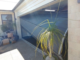 Why Is My Garage Door Crooked? Common Causes